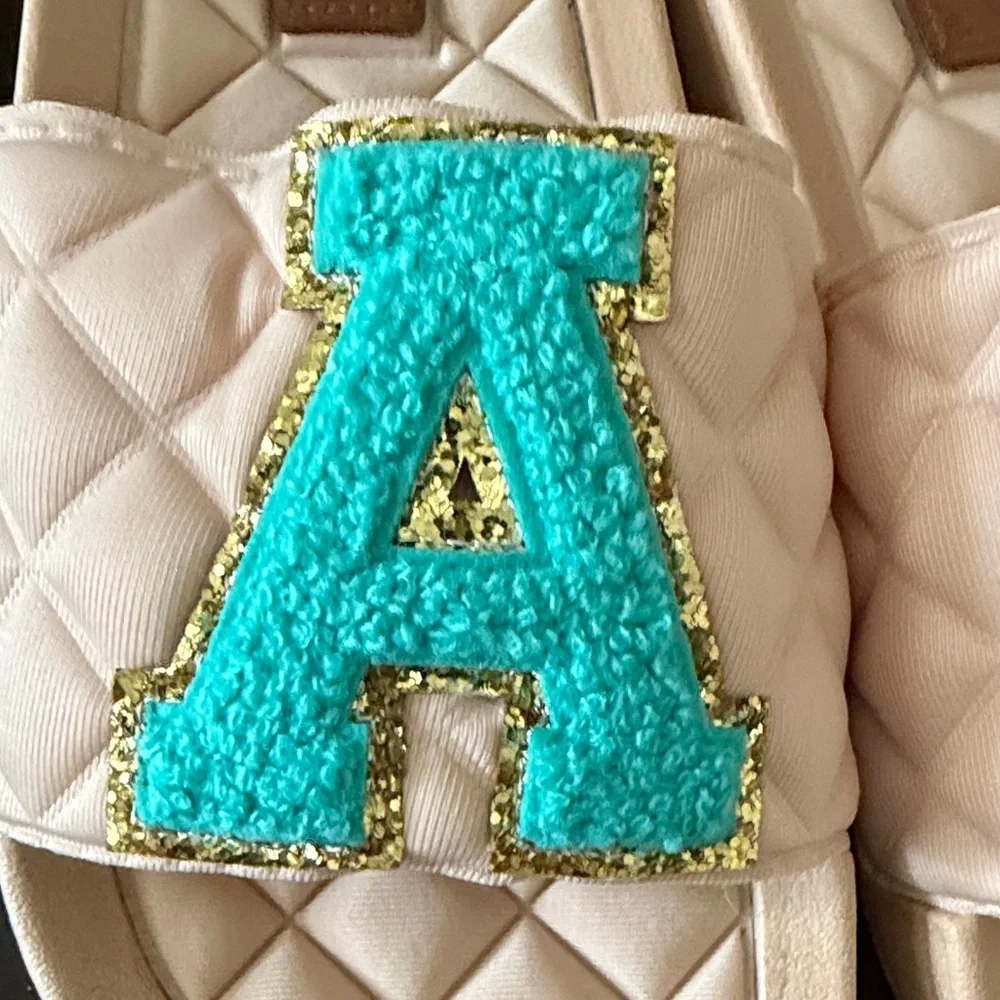 Judith March Beige Slide Sandals with Turquoise Letter Appliqués